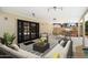 Cozy covered patio features a dining area, lounge seating, and outdoor kitchen with built-in grill at 7502 E Princeton Ave, Scottsdale, AZ 85257