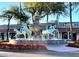 Striking horse fountain surrounded by vibrant red flowers, adding elegance to a charming town at 7502 E Princeton Ave, Scottsdale, AZ 85257