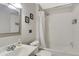 Well-lit bathroom featuring a shower-tub combo, white tiling, and clean fixtures, with essential amenities at 7520 E Papago Dr, Scottsdale, AZ 85257
