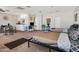 This bedroom features two beds, a kitchenette, and neutral-toned walls and carpet at 7520 E Papago Dr, Scottsdale, AZ 85257