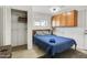 Bedroom featuring a blue bedspread, closet, and light-colored tile at 7520 E Papago Dr, Scottsdale, AZ 85257