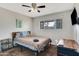 Bedroom with ceiling fan, window, and comfortable bed at 7520 E Papago Dr, Scottsdale, AZ 85257