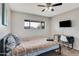 Bedroom features a window, desk, and comfortable bed at 7520 E Papago Dr, Scottsdale, AZ 85257
