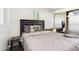 Cozy bedroom featuring a comfortable bed, stylish bedding, and a functional desk area with mirrored closet at 7520 E Papago Dr, Scottsdale, AZ 85257
