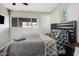 Bedroom features a window, art, and comfortable bed with dark headboard at 7520 E Papago Dr, Scottsdale, AZ 85257
