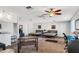 Bright bedroom featuring two beds, wood-look ceiling fan, and neutral-toned walls and carpet at 7520 E Papago Dr, Scottsdale, AZ 85257