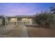Charming single-story home featuring a covered entry and low maintenance desert landscaping in front yard at 7520 E Papago Dr, Scottsdale, AZ 85257