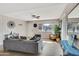 Bright living room with wood-look floors, comfortable seating, and a large window at 7520 E Papago Dr, Scottsdale, AZ 85257