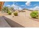Desert landscaped backyard with covered patio and block wall at 7916 W Mary Ann Dr, Peoria, AZ 85382