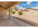 Patio area has a ceiling fan and shade, with desert landscaping in the background at 7916 W Mary Ann Dr, Peoria, AZ 85382