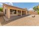 Backyard with desert landscaping and covered patio area at 7916 W Mary Ann Dr, Peoria, AZ 85382