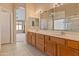 Bright bathroom features double vanity with plenty of natural light and tile flooring at 7916 W Mary Ann Dr, Peoria, AZ 85382