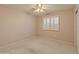 Neutral bedroom with ceiling fan, window shutters, and plush carpeting at 7916 W Mary Ann Dr, Peoria, AZ 85382