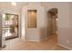 Inviting entryway featuring neutral paint, tile flooring, decorative niche, and an arched doorway leading further into the home at 7916 W Mary Ann Dr, Peoria, AZ 85382