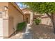 Inviting front entrance with covered porch, desert landscaping, and a well-lit walkway at 7916 W Mary Ann Dr, Peoria, AZ 85382