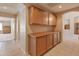 Hallway features ample storage cabinets, recessed lighting and easy access to nearby rooms at 7916 W Mary Ann Dr, Peoria, AZ 85382
