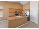 Kitchen features stainless steel appliances, breakfast bar, and tile flooring at 7916 W Mary Ann Dr, Peoria, AZ 85382