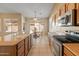 The kitchen features modern appliances and is open to the dining area at 7916 W Mary Ann Dr, Peoria, AZ 85382
