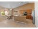 Open kitchen boasts a breakfast bar, stainless appliances, and adjacent dining area at 7916 W Mary Ann Dr, Peoria, AZ 85382