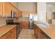 Well-equipped kitchen with stainless steel appliances and ample counter space at 7916 W Mary Ann Dr, Peoria, AZ 85382