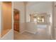 Open living area showcasing neutral paint, tile floors and views into the adjacent living spaces with natural light at 7916 W Mary Ann Dr, Peoria, AZ 85382