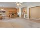 Spacious living area with tiled kitchen, open layout and bright natural lighting from the large windows at 7916 W Mary Ann Dr, Peoria, AZ 85382