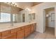 Spacious main bathroom with double sinks, a walk-in closet, and a separate shower at 7916 W Mary Ann Dr, Peoria, AZ 85382