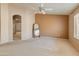 Spacious main bedroom with neutral carpet and an ensuite bathroom at 7916 W Mary Ann Dr, Peoria, AZ 85382