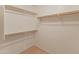Spacious walk-in closet with ample shelving for storage and organization at 7916 W Mary Ann Dr, Peoria, AZ 85382