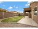 The backyard offers a green lawn, gravel landscaping, and a covered patio area at 881 W Saragosa St, Chandler, AZ 85225