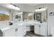 Bright bathroom featuring dual sinks, white countertops, and modern lighting fixtures at 881 W Saragosa St, Chandler, AZ 85225