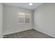 Simple bedroom featuring neutral walls, carpet, and a window at 881 W Saragosa St, Chandler, AZ 85225