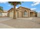 Charming single-story home with desert landscaping and a spacious two-car garage at 881 W Saragosa St, Chandler, AZ 85225