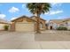 A cozy one-story home with a two-car garage and desert landscaping at 881 W Saragosa St, Chandler, AZ 85225