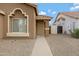 Close-up of the entrance featuring a secure door and desert-style landscaping at 881 W Saragosa St, Chandler, AZ 85225