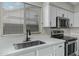 Close-up of a modern kitchen with stainless steel appliances and quartz countertops at 881 W Saragosa St, Chandler, AZ 85225