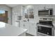 Bright kitchen featuring stainless steel appliances, quartz countertops, and white cabinets at 881 W Saragosa St, Chandler, AZ 85225