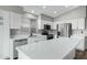 Updated kitchen featuring quartz countertops, white cabinets, stainless steel appliances, and an island at 881 W Saragosa St, Chandler, AZ 85225