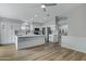 Open floorplan featuring an updated kitchen with white cabinets, island, and stainless appliances at 881 W Saragosa St, Chandler, AZ 85225