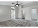 Spacious main bedroom with a ceiling fan and ensuite bath, featuring neutral gray walls at 881 W Saragosa St, Chandler, AZ 85225