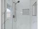 Close up of a shower with modern tile, shower head, and inset shelves at 881 W Saragosa St, Chandler, AZ 85225
