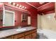 Full bathroom features a single sink vanity, granite countertop, and tub-shower combination at 9039 E Winchcomb Dr, Scottsdale, AZ 85260