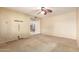 Cozy carpeted bedroom featuring a ceiling fan and neutral walls at 9039 E Winchcomb Dr, Scottsdale, AZ 85260