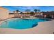 Bright and inviting community pool, complete with lounge seating and lush landscaping for a relaxing atmosphere at 9039 E Winchcomb Dr, Scottsdale, AZ 85260
