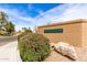 Attractive community signage for Scottsdale Vista North Townhomes, framed by mature landscaping and desert flora at 9039 E Winchcomb Dr, Scottsdale, AZ 85260