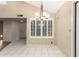 Dining area features tile flooring, neutral colors, and a decorative chandelier at 9039 E Winchcomb Dr, Scottsdale, AZ 85260