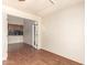 View of the Living Room with access to the Kitchen, and hardwood floors at 9039 E Winchcomb Dr, Scottsdale, AZ 85260