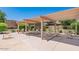 Inviting covered patio area with lounge chairs and seating, perfect for outdoor relaxation and entertaining at 9039 E Winchcomb Dr, Scottsdale, AZ 85260
