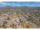 Wide aerial view of the community shows the mix of residential areas and the surrounding desert landscape at 907 N Mountain Rd, Mesa, AZ 85207