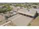 Aerial view showcases outdoor living spaces including an outdoor kitchen, patio, bocce ball court, and pergola at 907 N Mountain Rd, Mesa, AZ 85207
